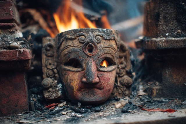 Burning Mask on Temple Altar