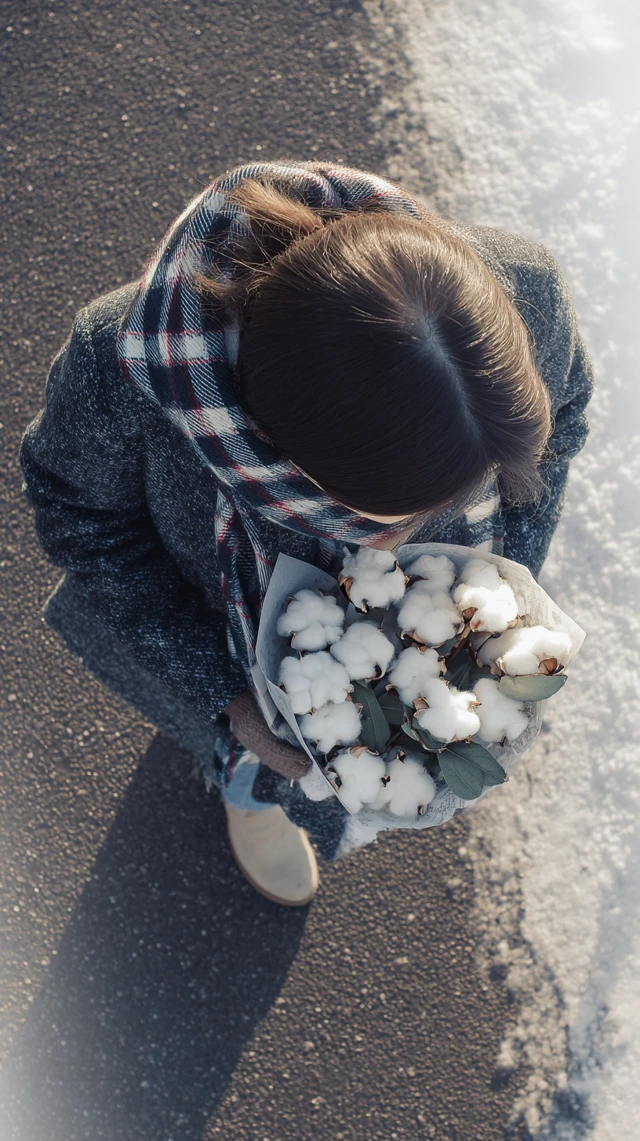 Winter Girl with Flowers in the Snow