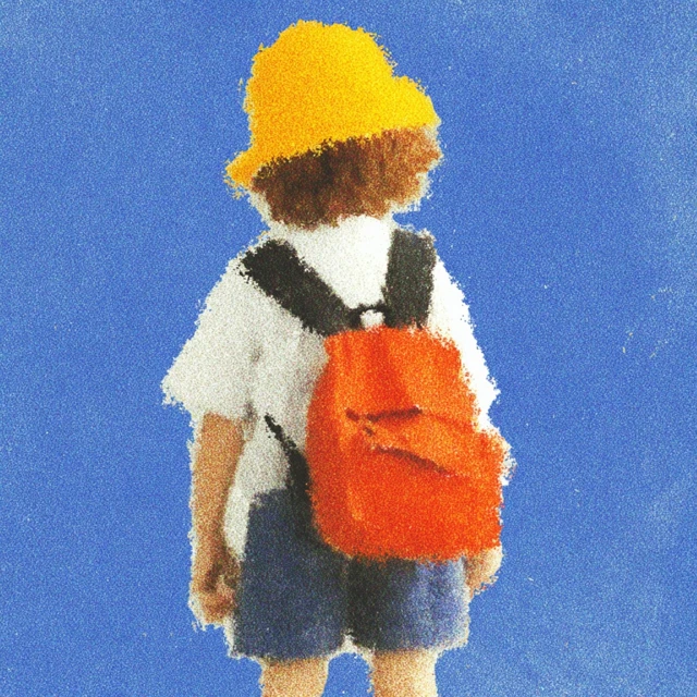 Child in School Uniform with Yellow Hat and Backpack