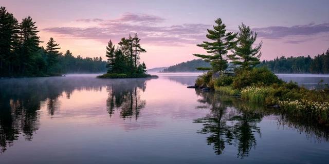Serene Lake at Dawn Reflecting Pastel Sky