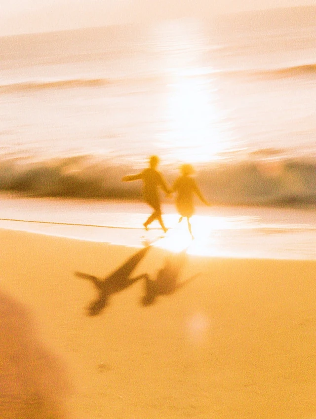 Couple Running on Beach Golden Hour Retro Photo