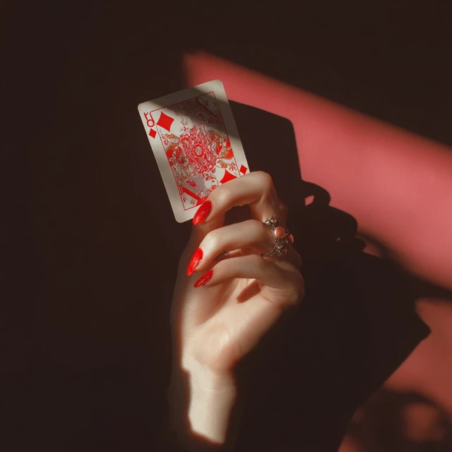 Female Hand Holding Playing Card Photography