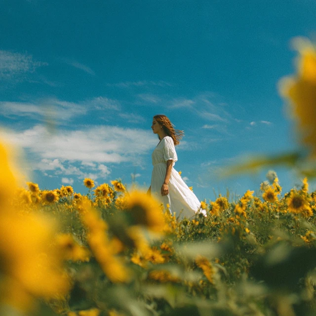 Woman in Sunflower Field Sunshine and Blue Sky