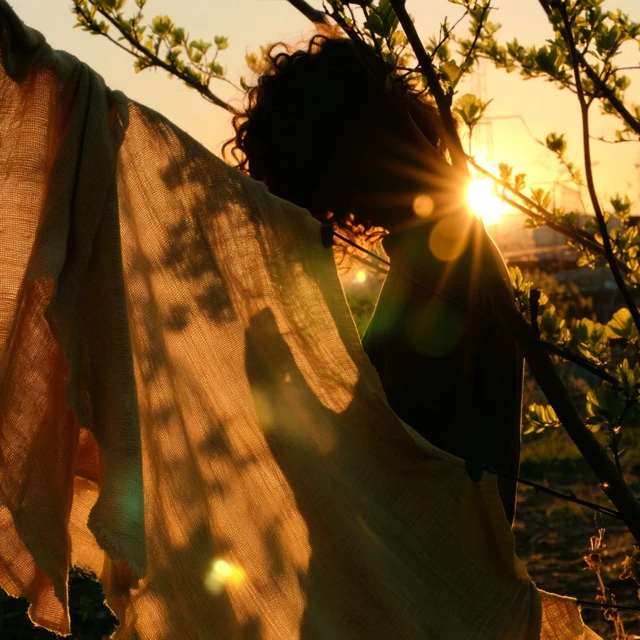 Golden Hour Silhouette: Girl and Fabric