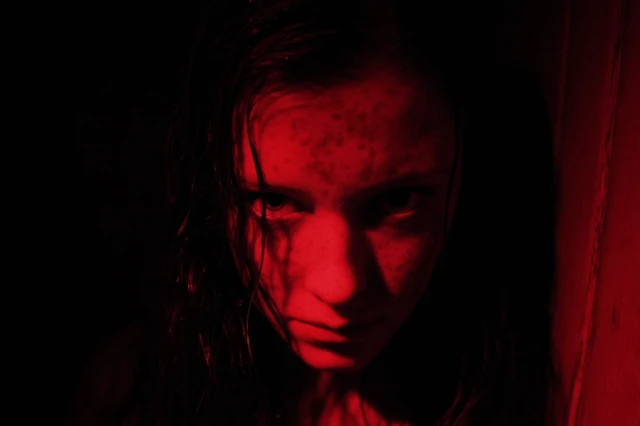 Portrait of a Moody Young Woman in the Dark