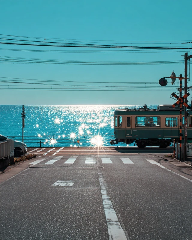 Japanese Train Crossing Road by the Sea