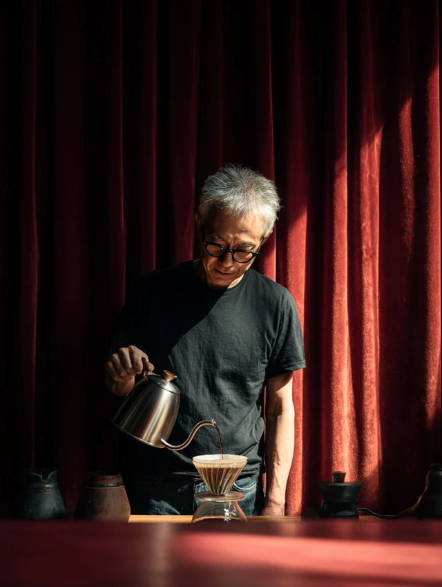 Man Brewing Coffee Pour Over Dramatic Lighting