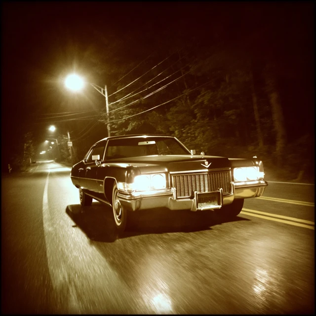 1972 Cadillac on a Dark Road at Night Vintage Sepia