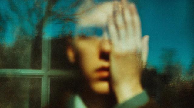 Person Presses Face Against Window