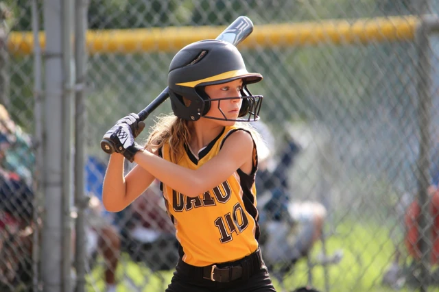 Youth Softball Player in Action Photo