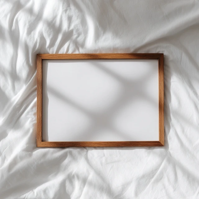 Wooden Picture Frame on White Bed Sheet