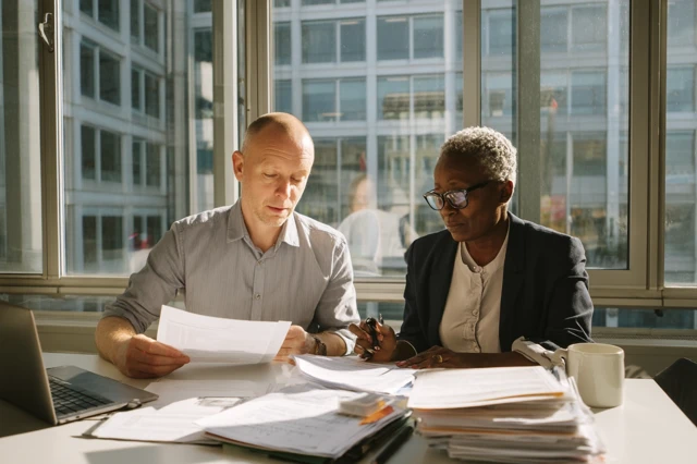 Business Meeting Reviewing Documents Office