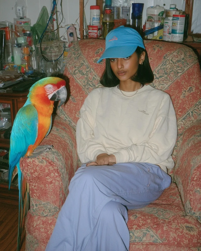 Woman in Cap with Parrot iPhone 14 Photo