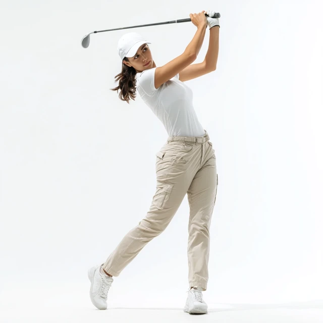 Female Golfer in Action Golf Swing White Outfit
