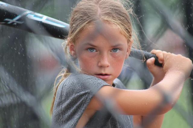 Youth Softball Player in Action Photo