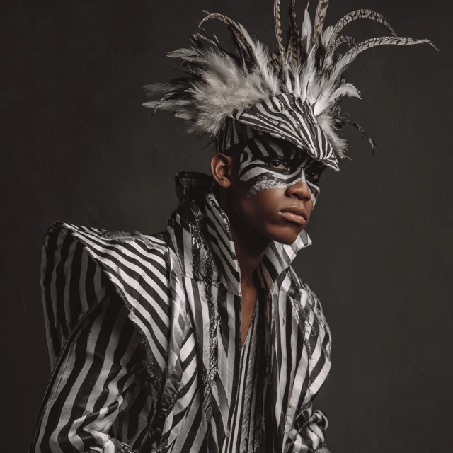 Fashion Photoshoot Man in Exotic Striped Outfit