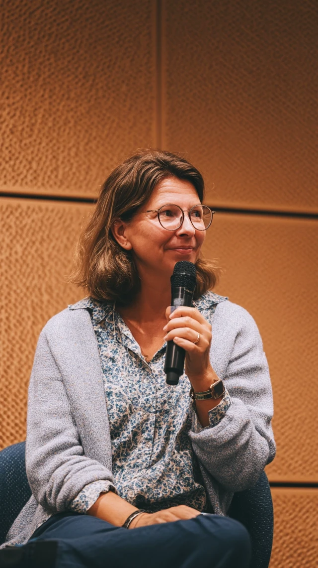Woman on Stage Giving a Lecture Interview