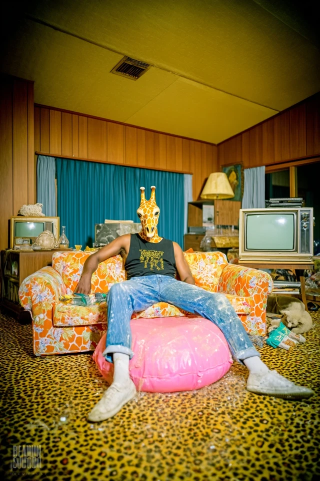 Surreal Retro Scene Giraffe Man on Floral Couch