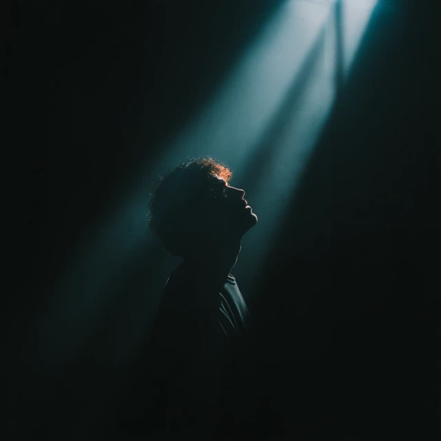 Man in Silhouette with Light Burst
