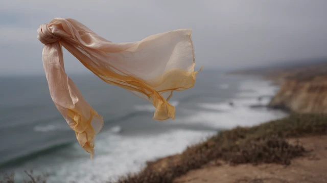 Silk Scarf Flying Over Cliff Ocean Dramatic Sky