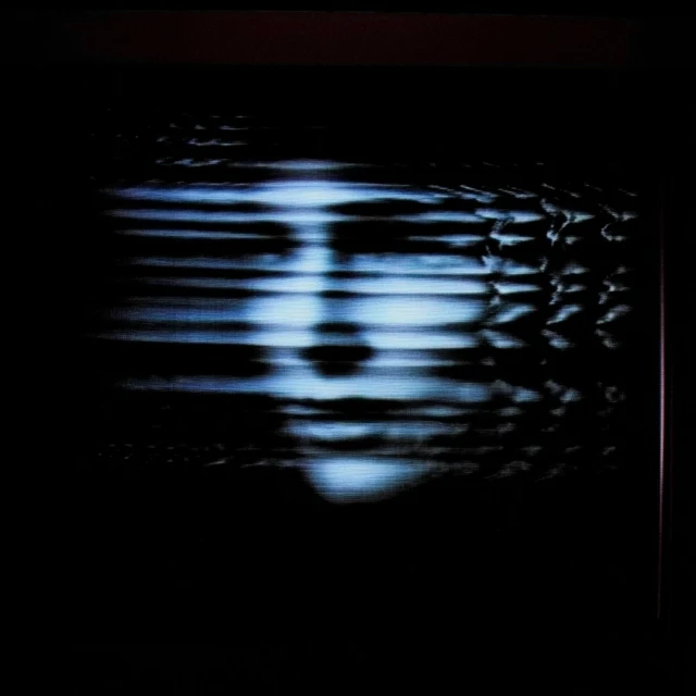 Abstract album art with a ghostly face