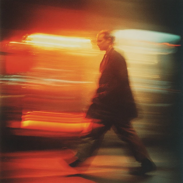 1990s Night Photography Man Walking with Motion Blur