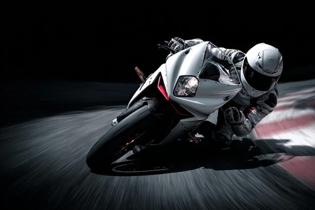 Motorcycle Rider Speeding Leaning in Corner Valencia Spain