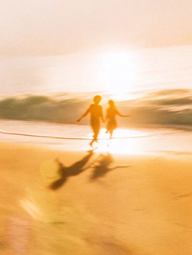 Couple Running on Beach Golden Hour Retro Photo