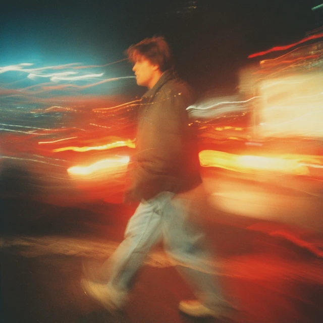 1990s Night Photography Man Walking with Motion Blur