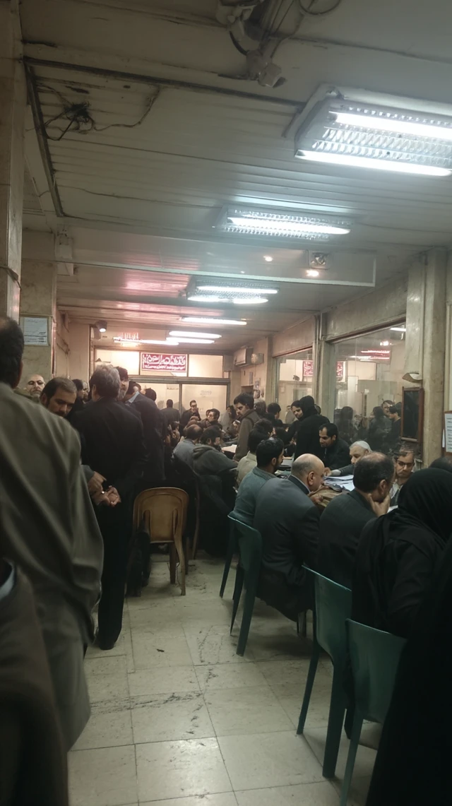 Crowded Iranian Regulatory Office Interior