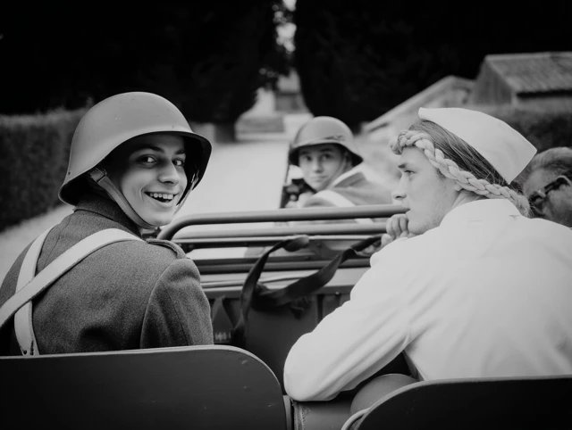 WWII Civilians Smiling Black and White Photo