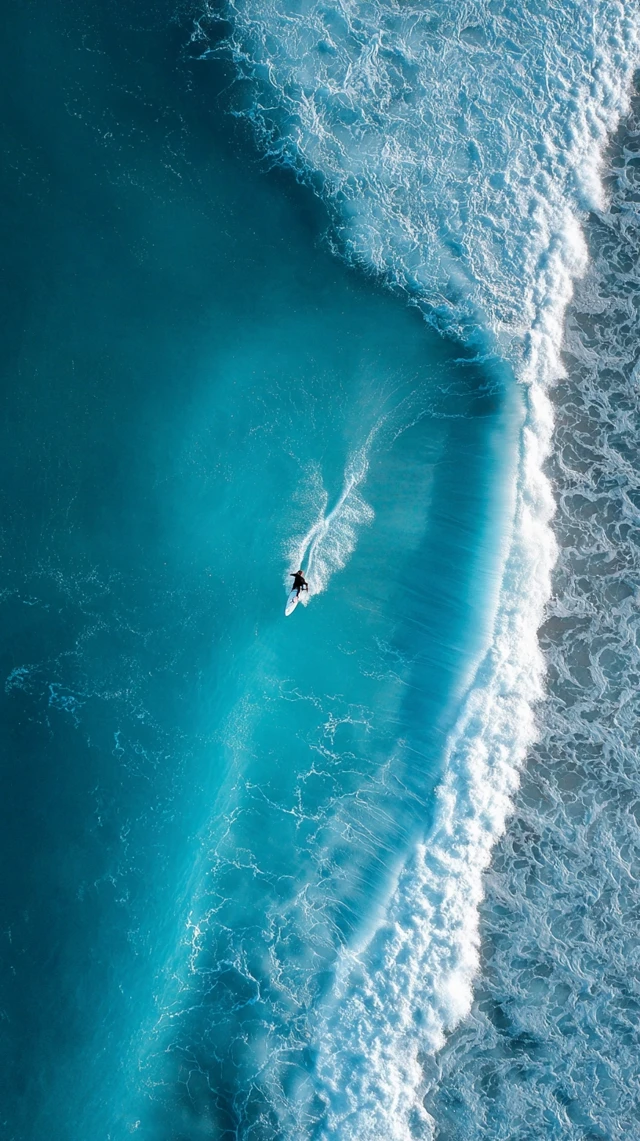 Surfer Riding Wave Aerial View Ocean Blue Wallpaper