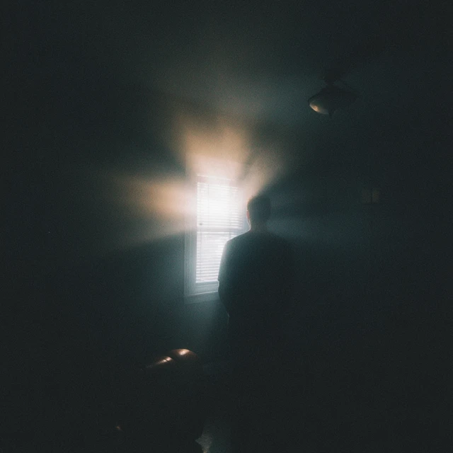 Man in Silhouette with Light Burst