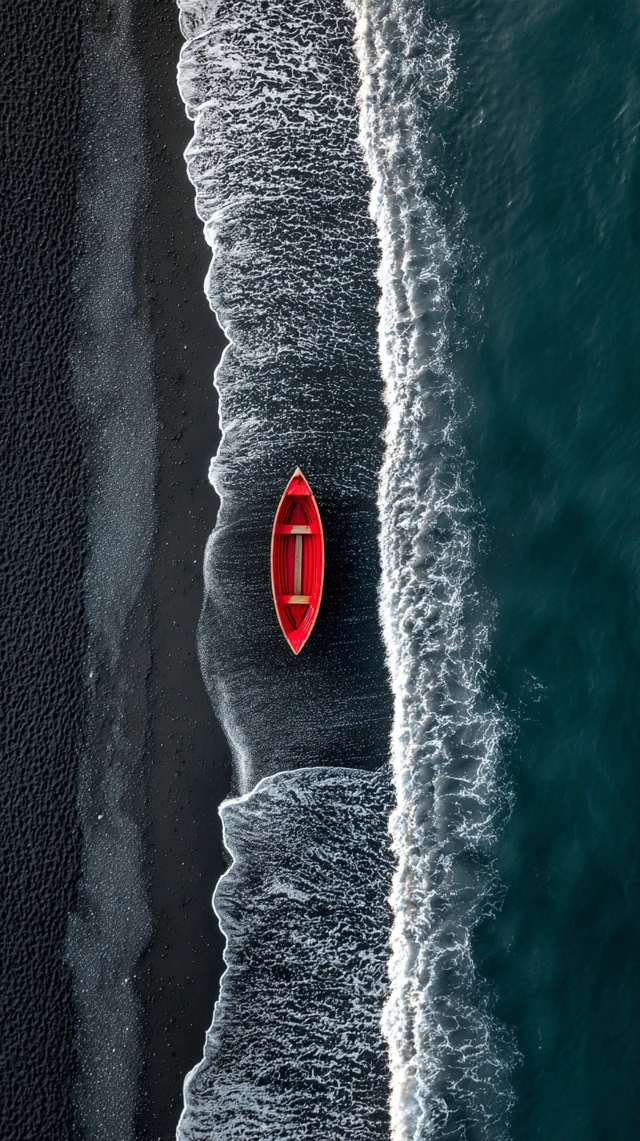 Red Boat on Black Sand Beach Iceland Aerial View