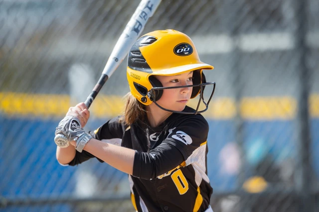 Youth Softball Player in Action Photo