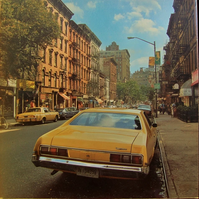 Early 70s New York Harlem Street with Yellow Taxi