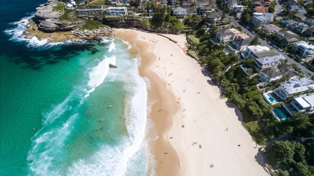 Coastal Beach Aerial View Turquoise Ocean and Lush Greenery