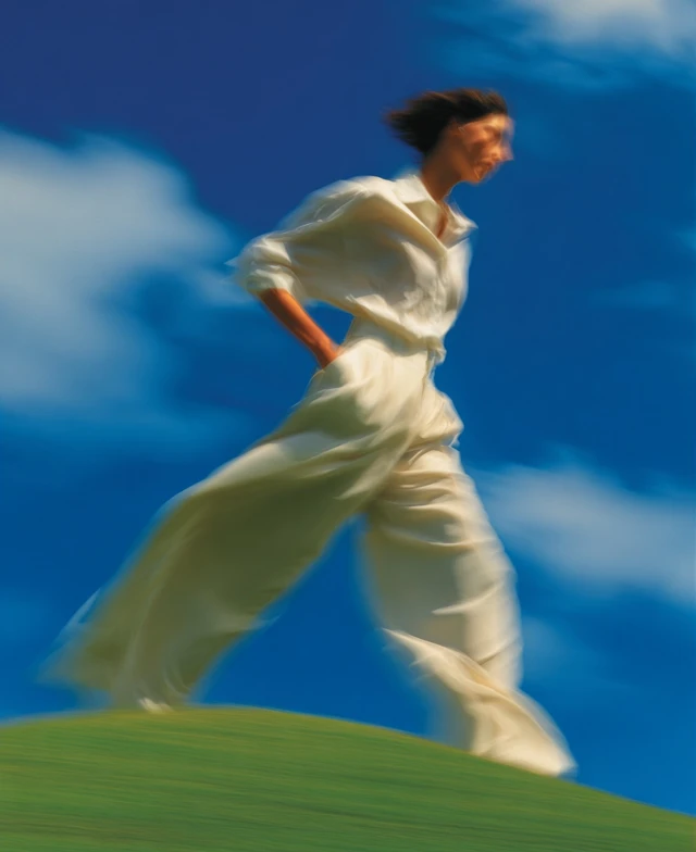 Woman Running on a Hill Photo in Peter Lindbergh Style