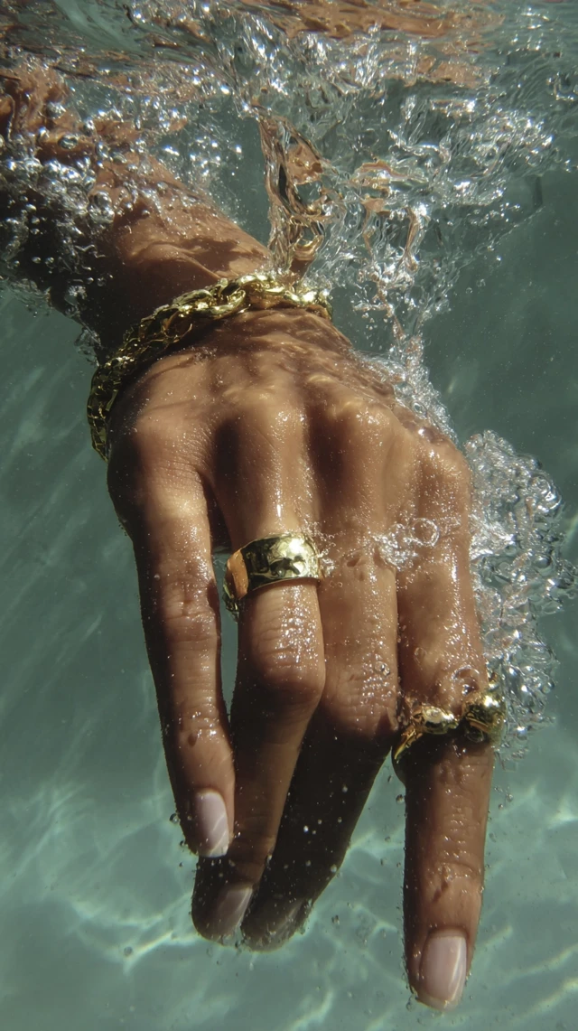 Luxury Hand Under Water Gold Rings Editorial Style