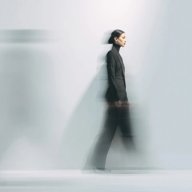 Stylish Woman in Tailored Suit Motion Blur