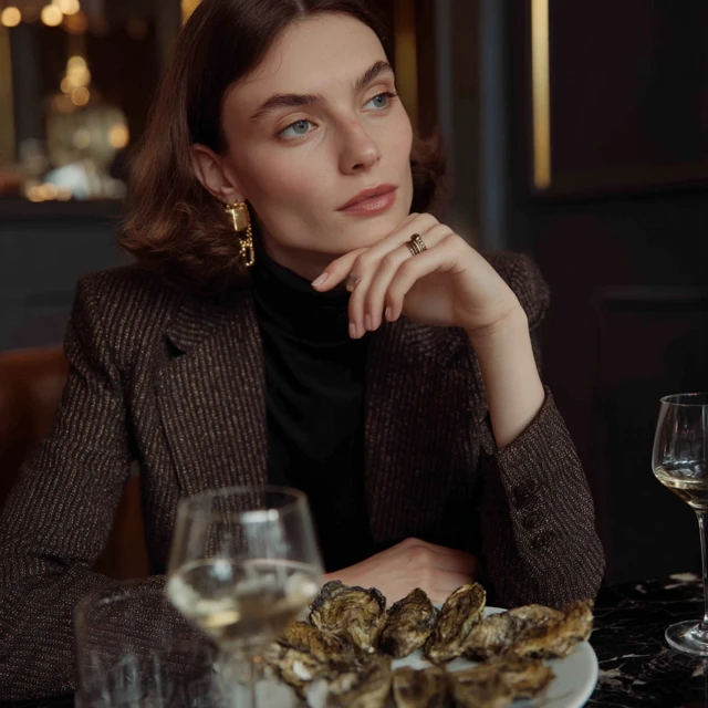 Woman in Luxury Restaurant with Oysters