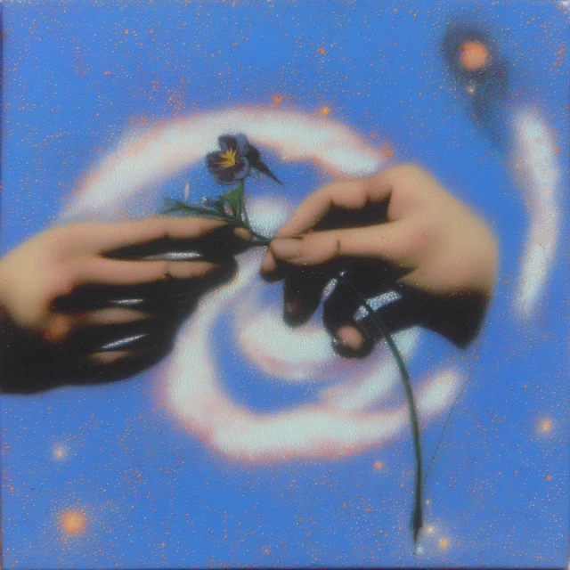 Hands Holding Galaxy Art in Pastel Colors