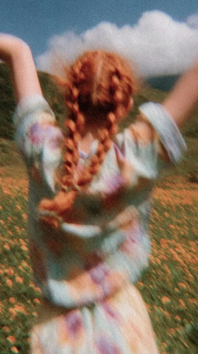 Red Haired Girl in Flower Field Freedom and Calm