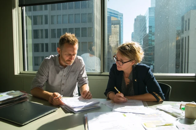 Business Meeting Reviewing Documents Office