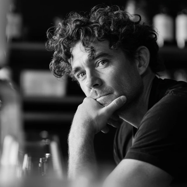 Thoughtful Barista Portrait with Coffee