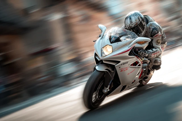 Motorcycle Rider Speeding Leaning in Corner Valencia Spain