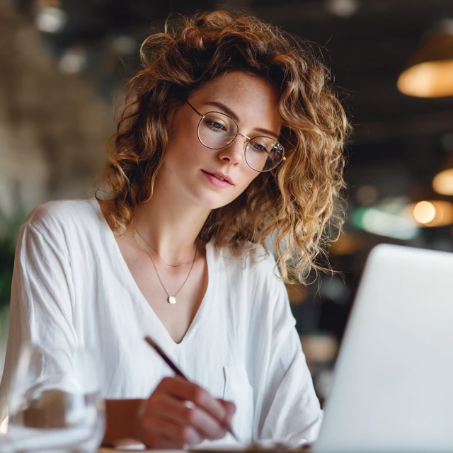 Businesswoman Writing Email Focused and Positive