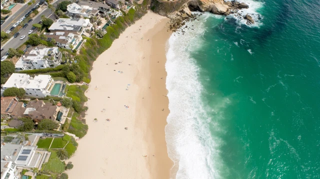 Coastal Beach Aerial View Turquoise Ocean and Lush Greenery