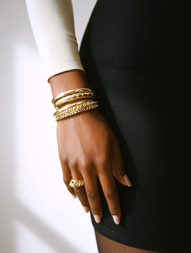 African American Model Hand with Gold Jewelry