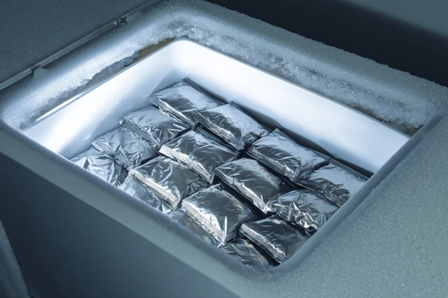 Open Chest Freezer with Frozen Food Pouches